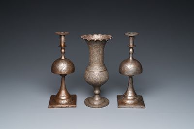 Une paire de bougeoirs et un vase en acier damascené, art qadjar, la Perse, 19ème