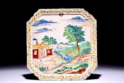 Une plaque de forme carrée en faïence de Delft polychrome petit feu à décor d'un paysage, 18ème