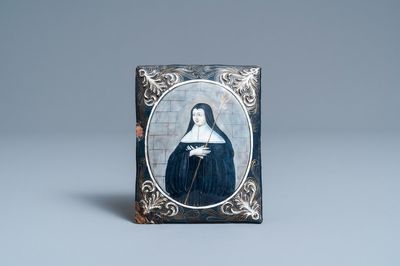 Une plaque en émail peint polychrome représentant une sainte carmélite, signée Jacques Laudin, Limoges, France, fin du 17ème