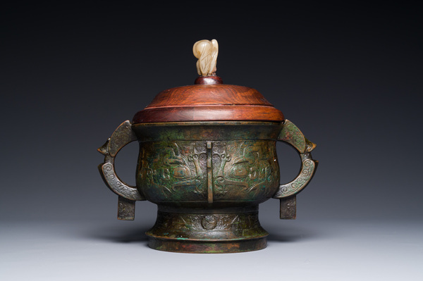 An unusual Chinese archaistic bronze censer with wooden cover, 'gui ...