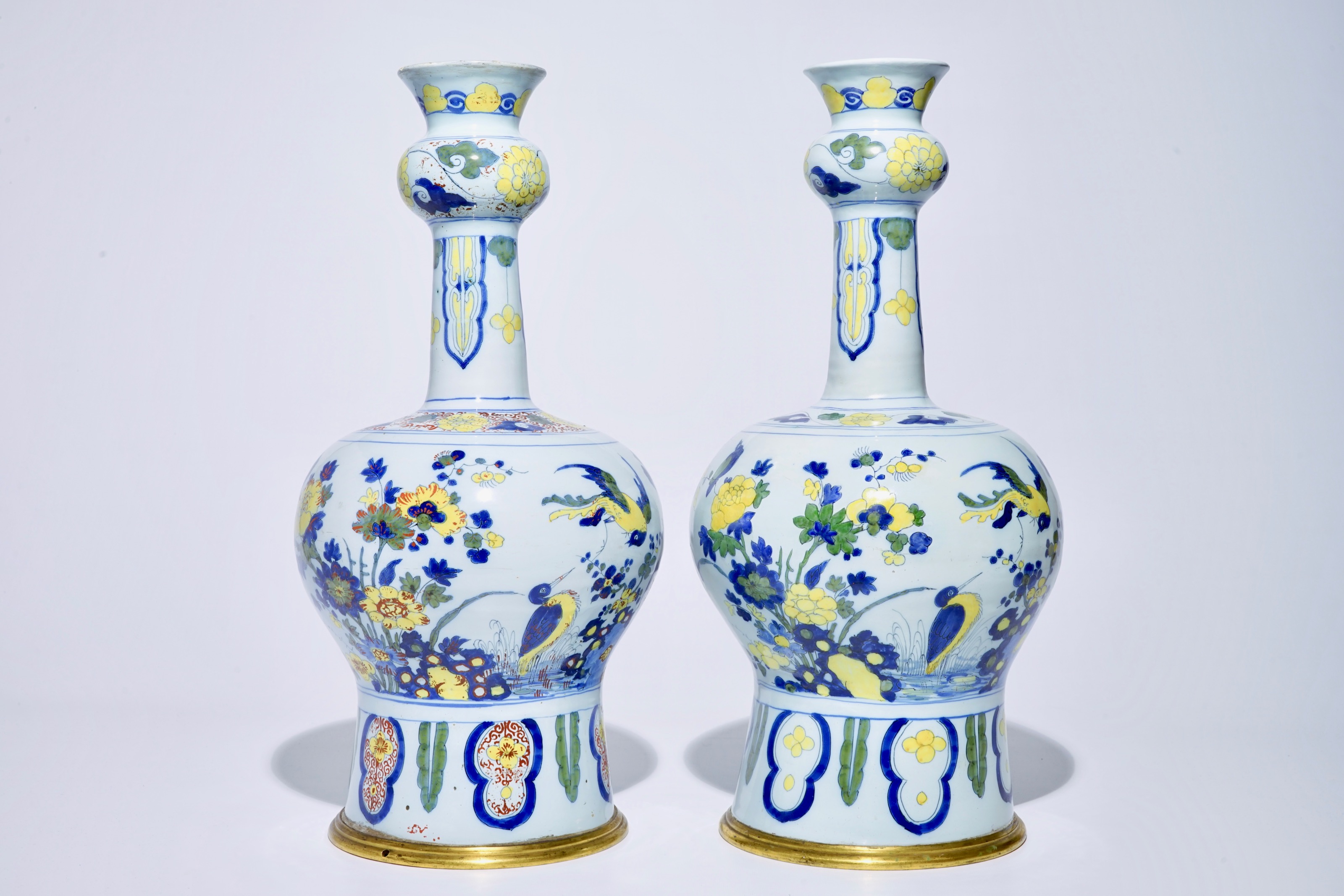 A pair of tall bronze-mounted polychrome Dutch Delft garlic-necked ...