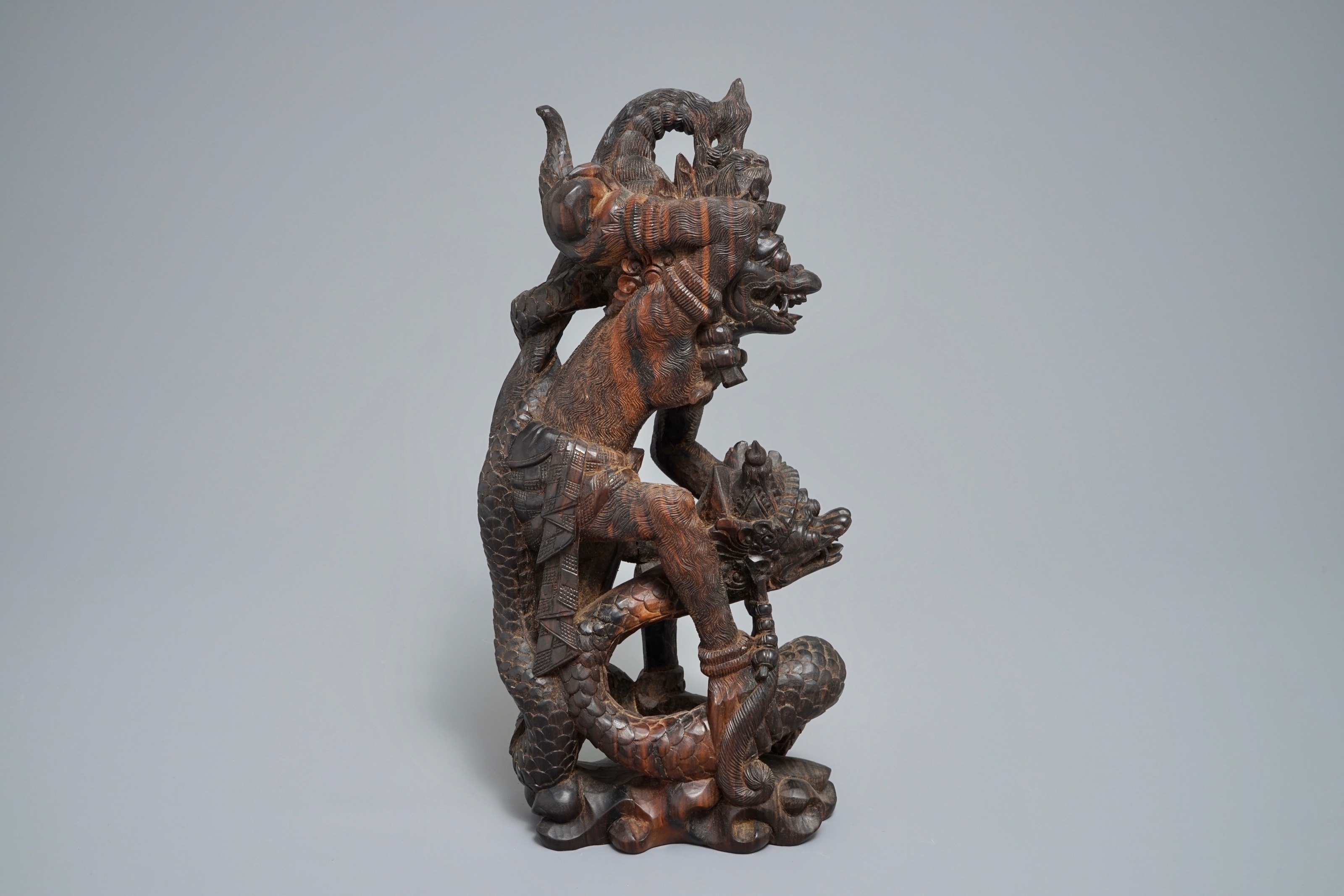 An Indonesian calamandar wooden sculpture of Vishnu riding Naga, 19th C ...