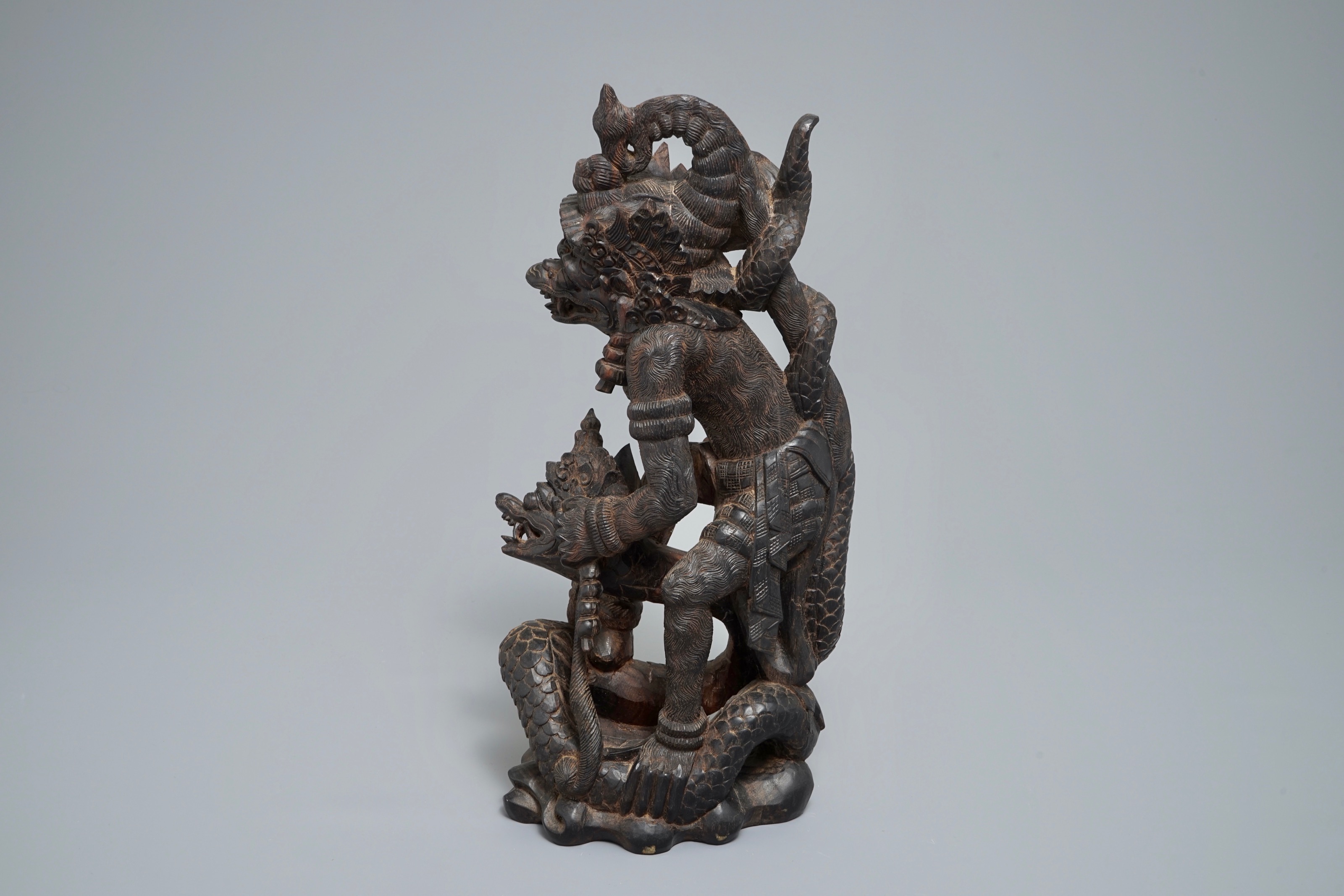 An Indonesian calamandar wooden sculpture of Vishnu riding Naga, 19th C ...