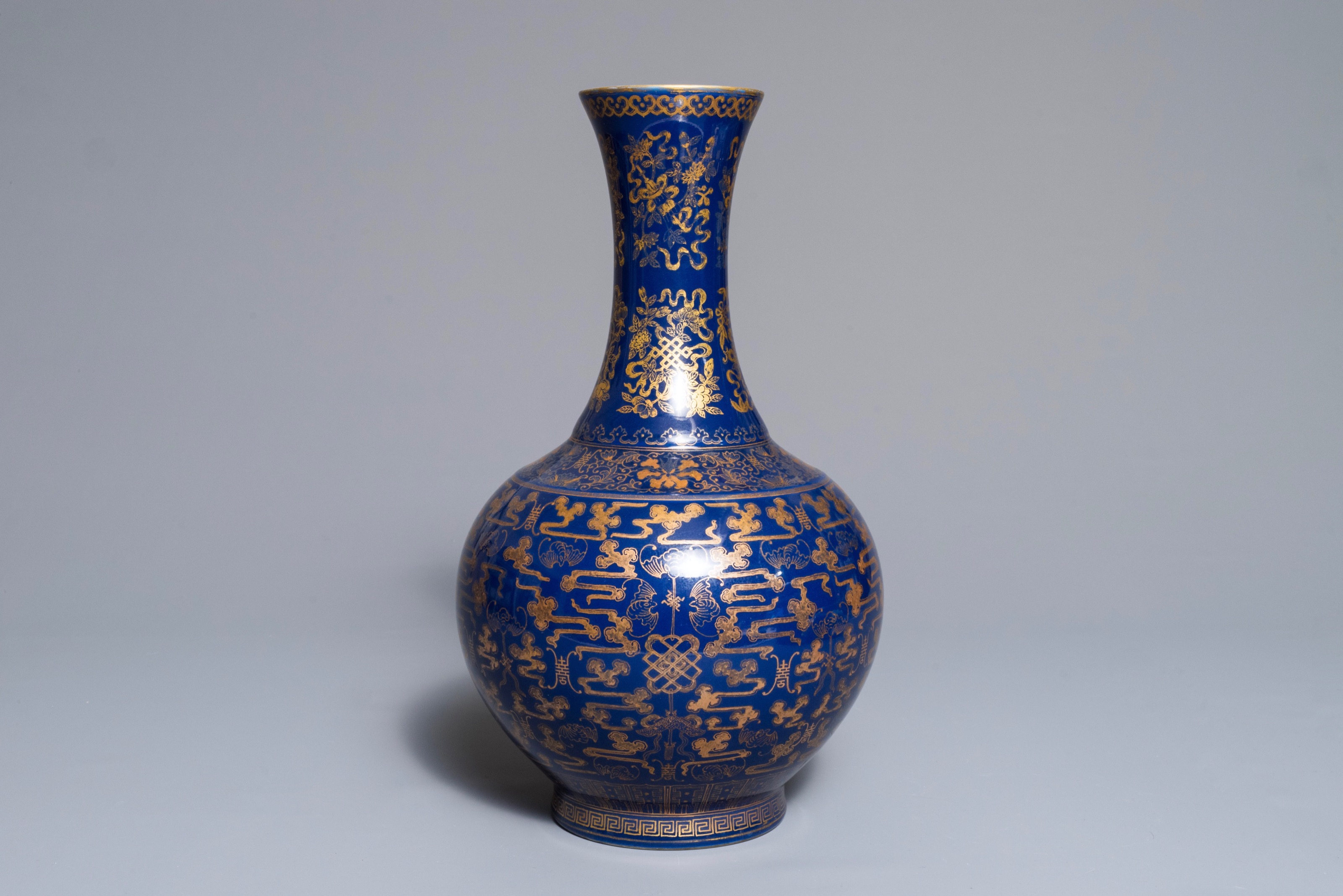 A Chinese gilt-decorated blue-ground bottle vase, Guangxu mark and of ...