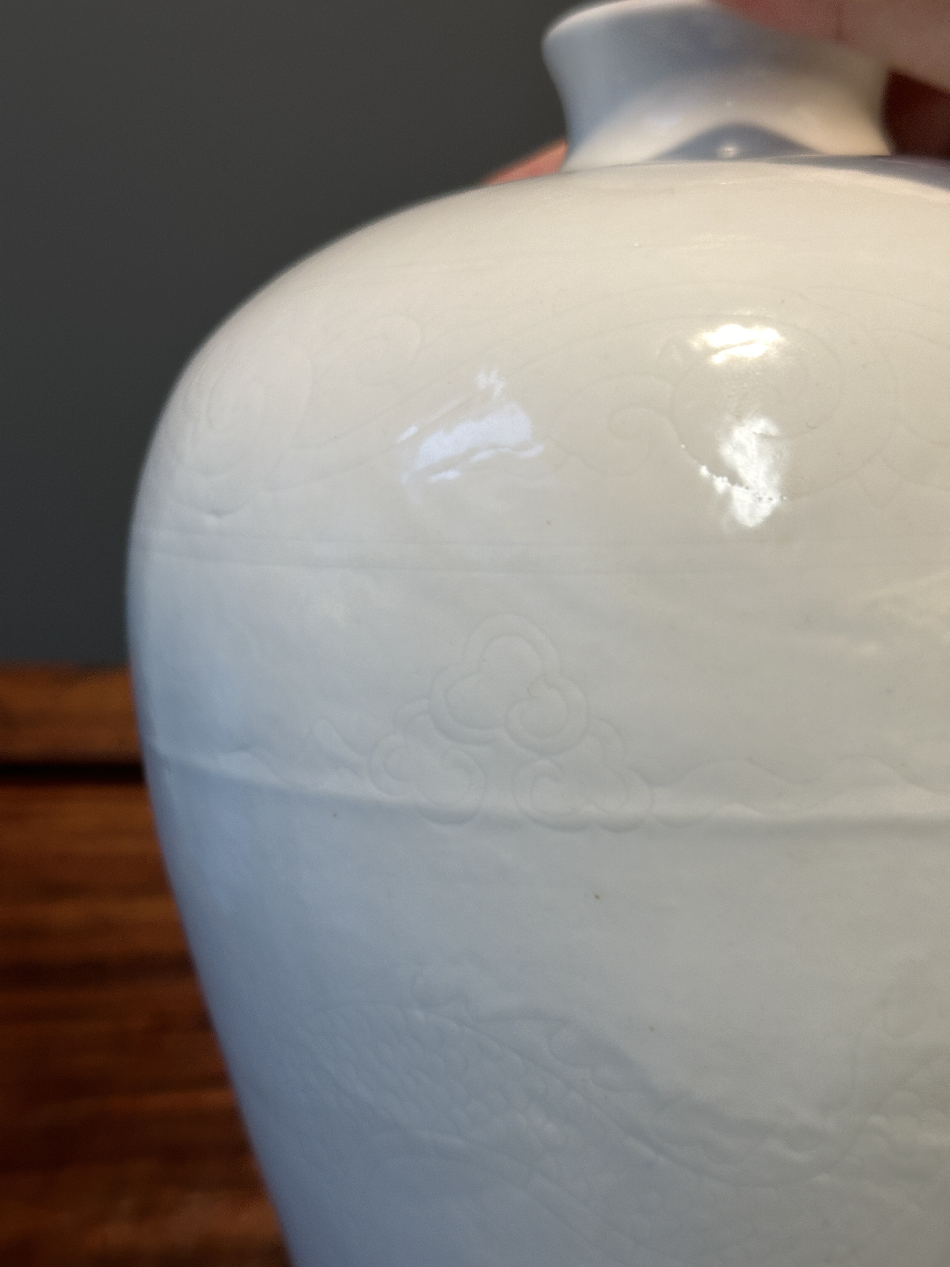 A Chinese monochrome white-glazed 'meiping' vase with anhua dragon ...