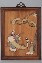 A pair of Chinese wooden panels with soap stone decoration, ca. 1900