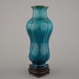An unusual Chinese turquoise monochrome vase on carved wood stand, 18th C.