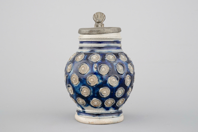 A globular Westerwald stoneware jug with appliques and pewter lid, dated 1689