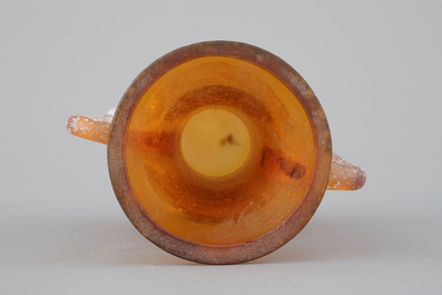 A green glass wine bottle, 18th C. and an orange glass amphora after the Antique