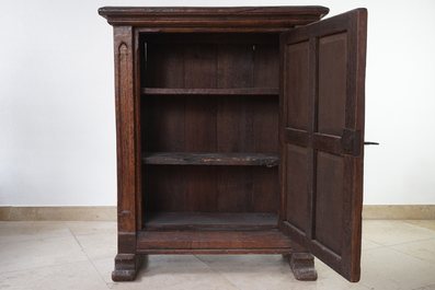 A gothic revival one door oak cabinet, 19th C.