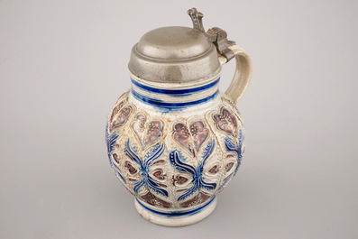 A manganese and blue Westerwald pewter-mounted globular jug, 17th C.