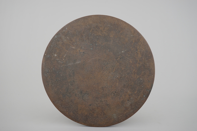 A large Chinese bronze mirror, probably Ming Dynasty