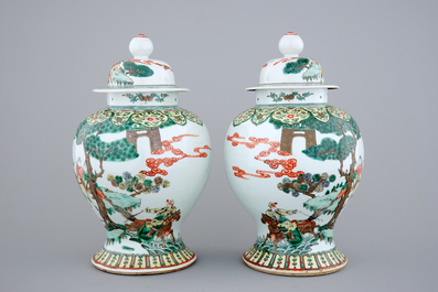 A pair of Chinese wucai porcelain warrior vases with covers, 19/20th C.