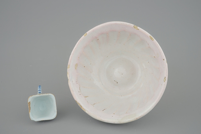 A white Dutch Delft baking mold and a miniature cup, 18th C.