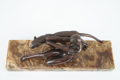 Alexandre Ouline, Art Deco group of a lady with a panther, bronze on onyx base, 20th C.