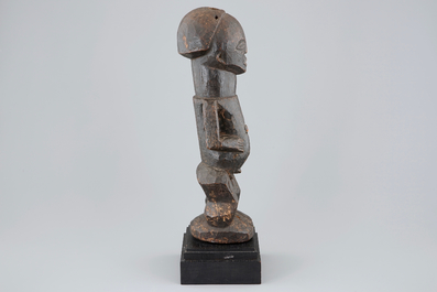 An African carved wood fetish figure on stand, Songye, Congo, mid 20th C.