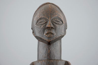 An African carved wood fetish figure on stand, Songye, Congo, mid 20th C.