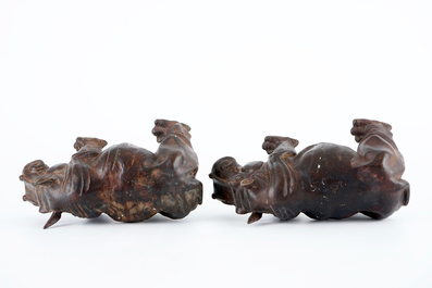 A group of bronze and regule animals: a group of cats, two hippos and a crane, 20th C.