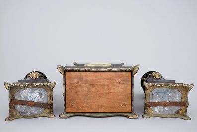 A three-piece gilt bronze and black marble chinoiserie garniture, 19th C.