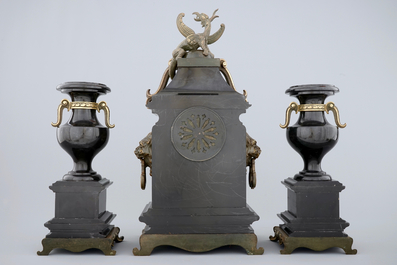 A three-piece gilt bronze and black marble chinoiserie garniture, 19th C.