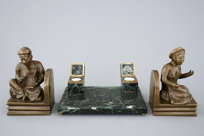 An art deco green marble inkwell and a pair of figurative book ends, 20th C.