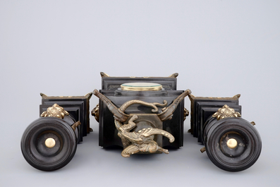 A three-piece gilt bronze and black marble chinoiserie garniture, 19th C.