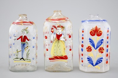 Four German painted glass flasks and a beaker, 18th C.
