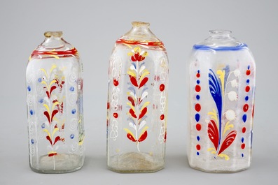 Four German painted glass flasks and a beaker, 18th C.