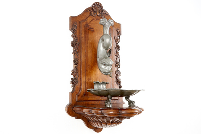 A pewter wall fountain and basin on a carved wood stand, 18/19th C.