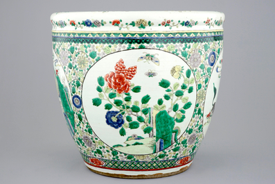 A large Chinese famille verte fish bowl with mythological animals, 19th C.