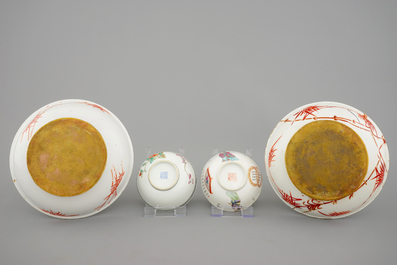 Two Chinese famille rose bowls and two candlesticks, 19th C.