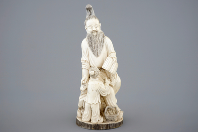 A Chinese carved ivory group of a sage with a child, 19th C.