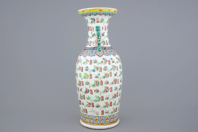 A tall Chinese famille rose vase with luck symbols and fruits, 19th C.