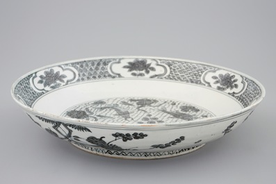 A Chinese Swatow dish with a blue-grey design of fish, Ming Dynasty, 16/17th C.