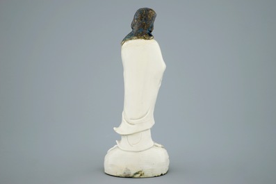An unusual Chinese Dehua blanc de Chine figure of a black-scarved Luohan, 19th C.