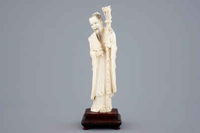 A Chinese ivory figure of Zhongli Quan on stand, late 19th C.