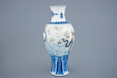 A Chinese baluster-shaped dragon vase in blue, white and underglaze red, Kangxi