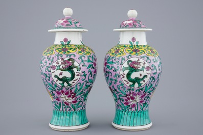 A pair of Chinese famille rose vases and covers, 19/20th C.