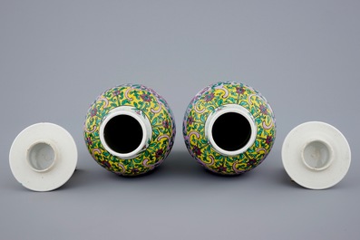 A pair of Chinese famille rose vases and covers, 19/20th C.