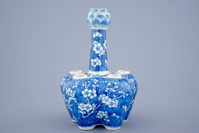 A Chinese blue and white tulip vase with prunus design, 19th C.