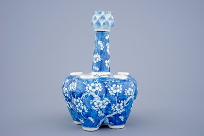 A Chinese blue and white tulip vase with prunus design, 19th C.