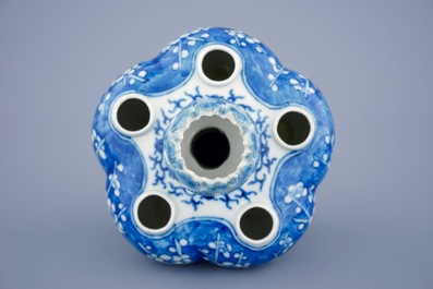 A Chinese blue and white tulip vase with prunus design, 19th C.