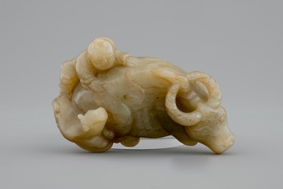 A Chinese jade group of a boy on a buffalo, 18/19th C.