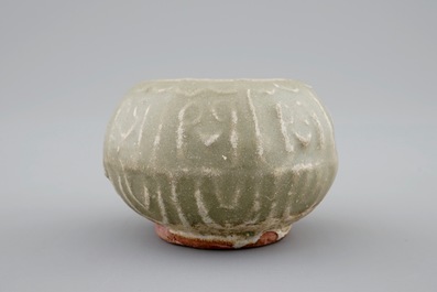 A Chinese celadon bird feeder, late Ming Dynasty