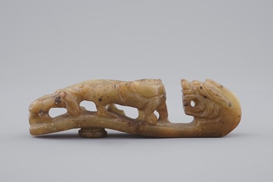 A Chinese mottled jade belt hook, 20th C.