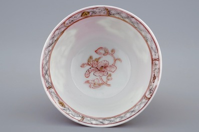A Chinese eggshell ruby ground cup and saucer, Yongzheng, 1723-1735