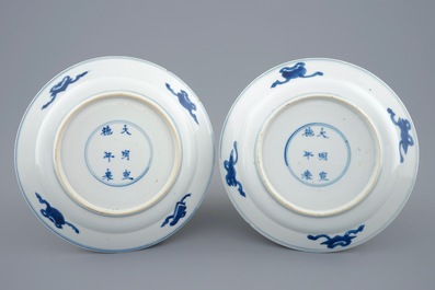 A pair of Chinese blue and white dragon plates, Xuande marks, Kangxi