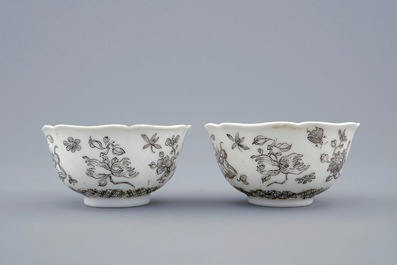 A pair of Chinese grisaille and gilt cups and saucers with insects among fruits and flowers, Yongzheng, 1723-1735