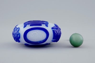 A Chinese blue and white overlay glass snuff bottle, 19th C.