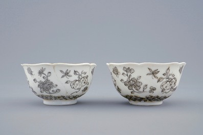 A pair of Chinese grisaille and gilt cups and saucers with insects among fruits and flowers, Yongzheng, 1723-1735